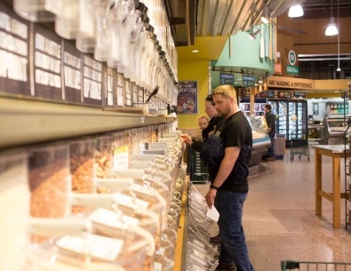Person standing in the bulk section of a co-op