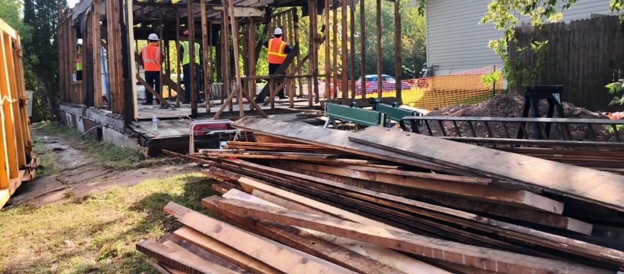 Pile of wood lumber reclaimed from demolition site