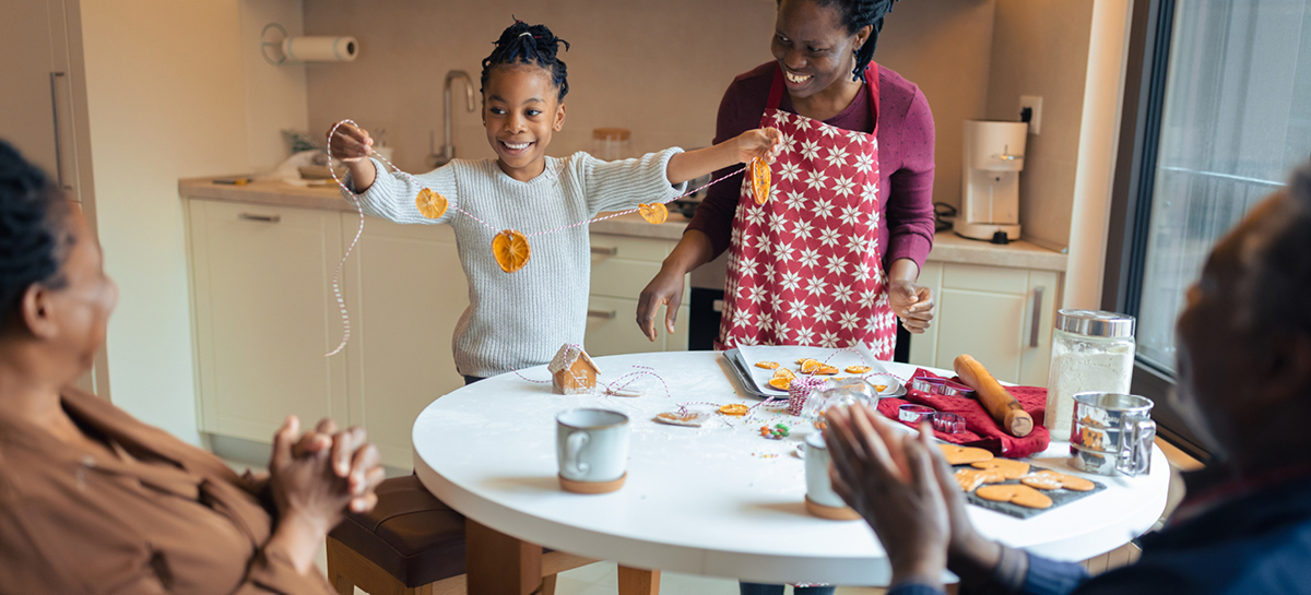Family making homemade dried orange slice garlands