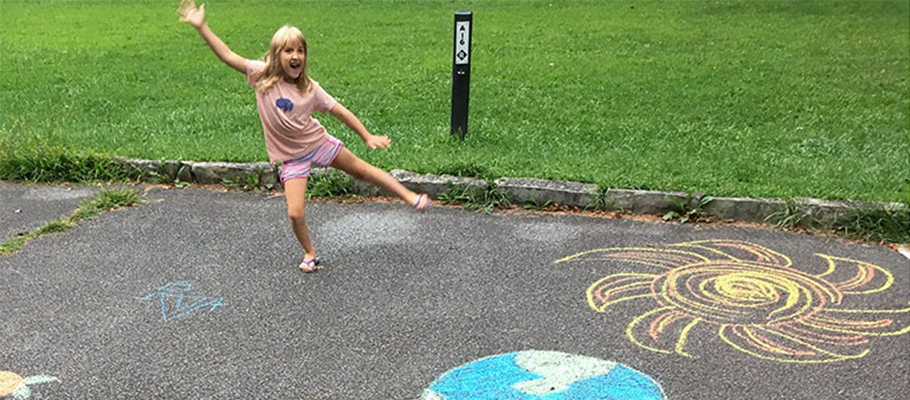 Kids art sidewalk chalk art of sun and moon