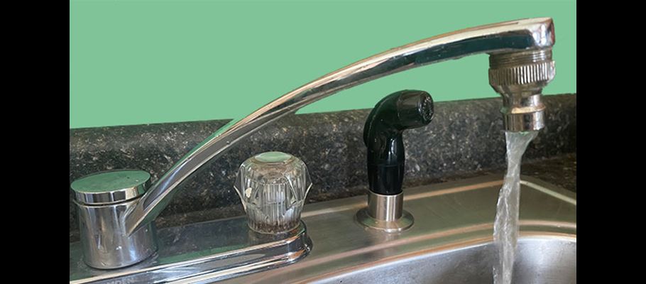 Tap on sink with running water