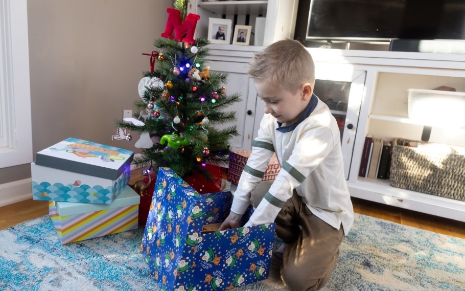 Boy opening Christmas present