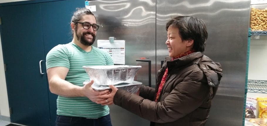 person delivering food to someone else