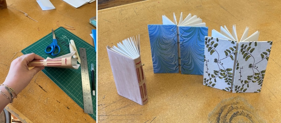 Close-up of person's hands showing the spine of a handmade book bound in twine