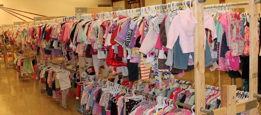 rows of children's clothing at thrift store