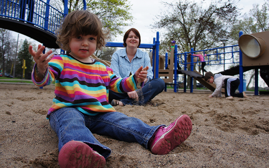 Girl on playground in cute clothes