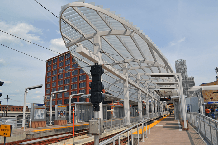 A photo of the big round canopy that protects the train and passengers.
